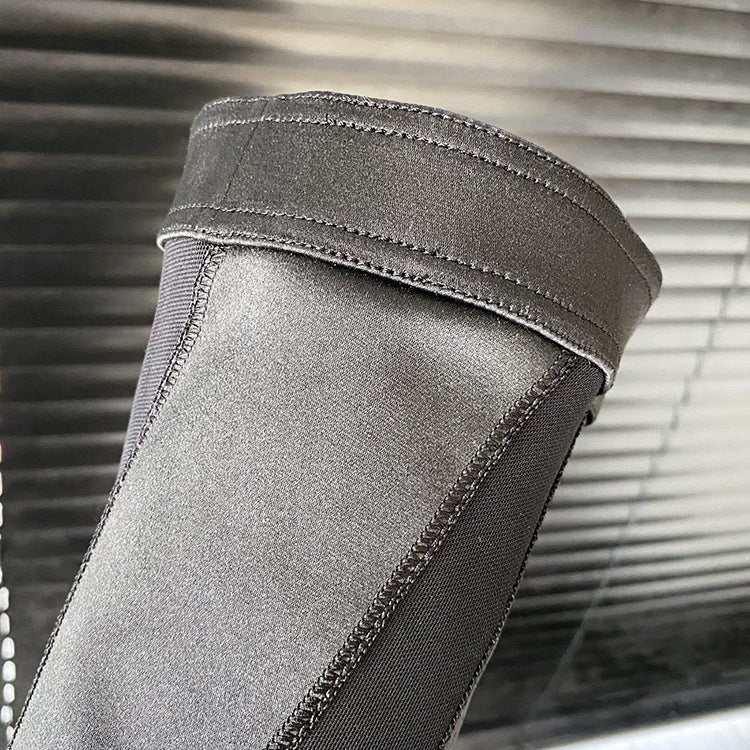 Gray knee brace with a textured surface against a blurred background