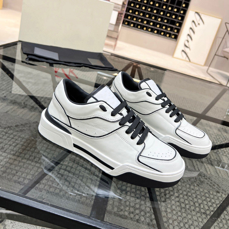 White sneakers with black accents on a glass table