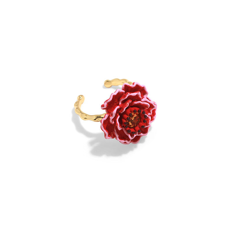 Red floral ring with gold band on a white background