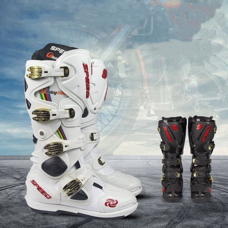White and black motocross boots with visible branding on a blurred background