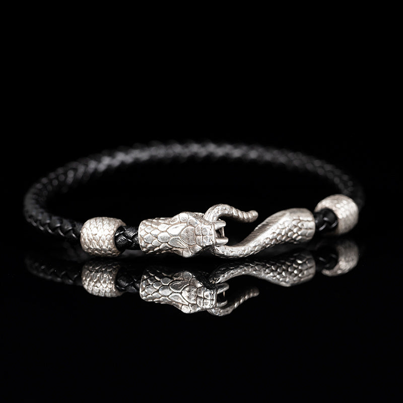Bracelet with snake design on a black background