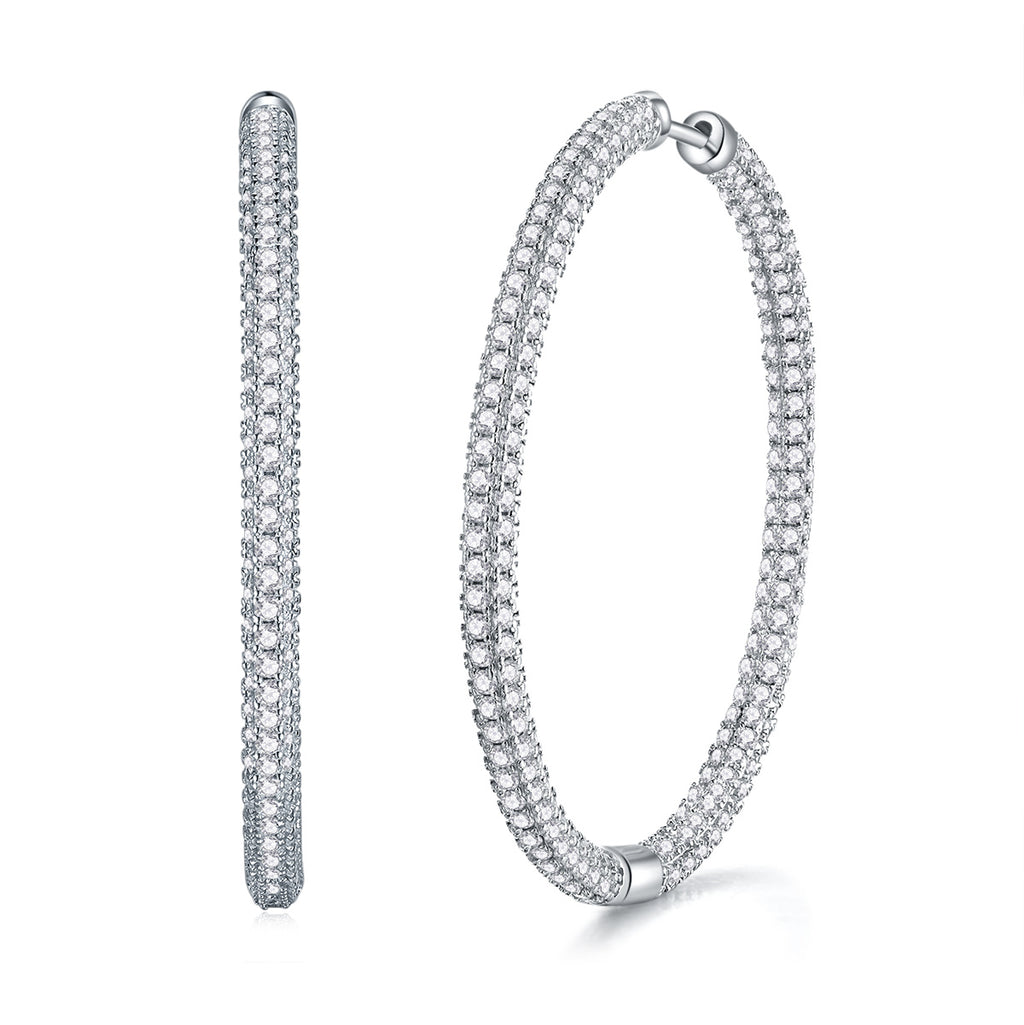 Pair of silver hoop earrings on a white background