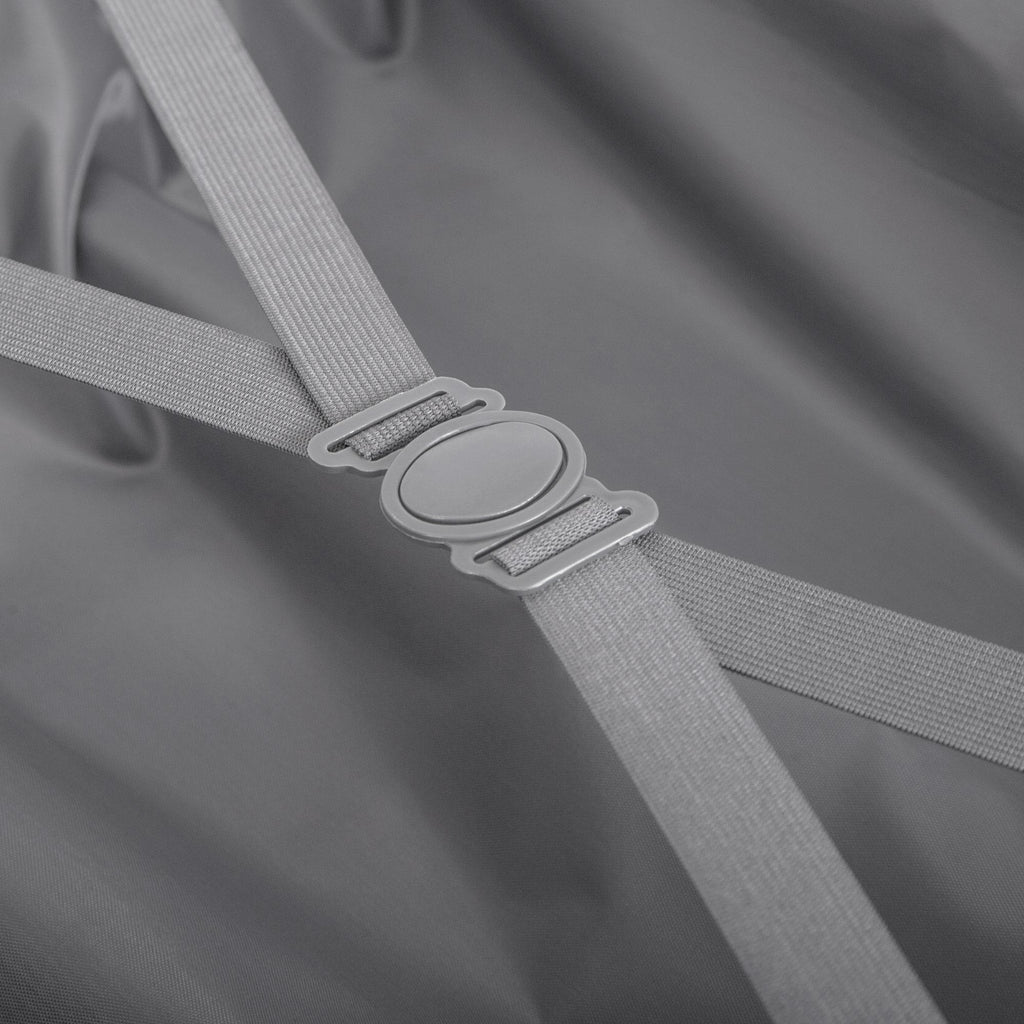 Close-up of a gray strap with a metal buckle on a gray background