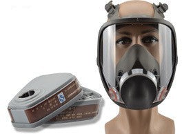 Full-face safety mask on a mannequin with a roll of tape in the foreground