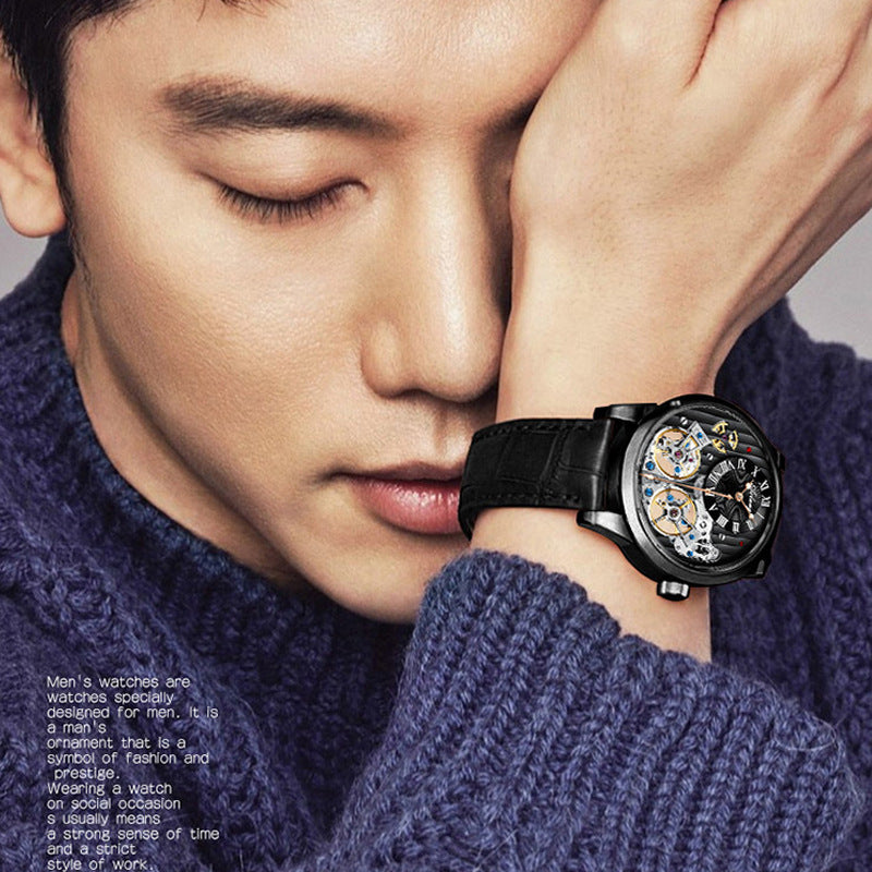 Man wearing a black wristwatch with a detailed face, wearing a blue sweater.