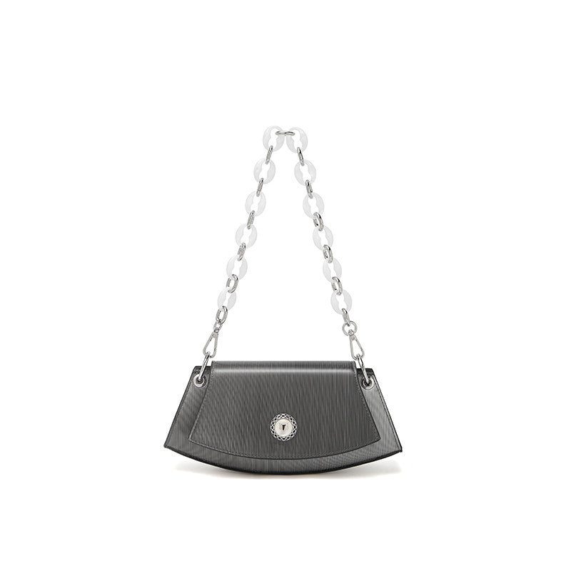 Black handbag with a chain strap on a white background