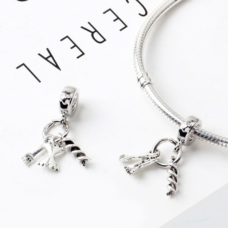 Silver bracelet with charms on a white background