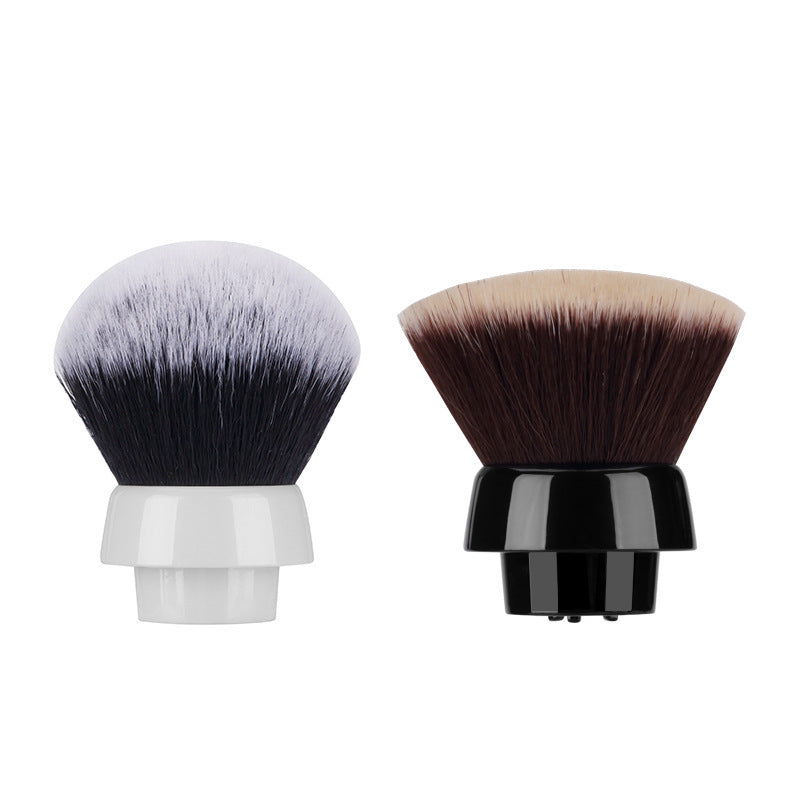 Two makeup brushes with black and white bristle heads on a white background