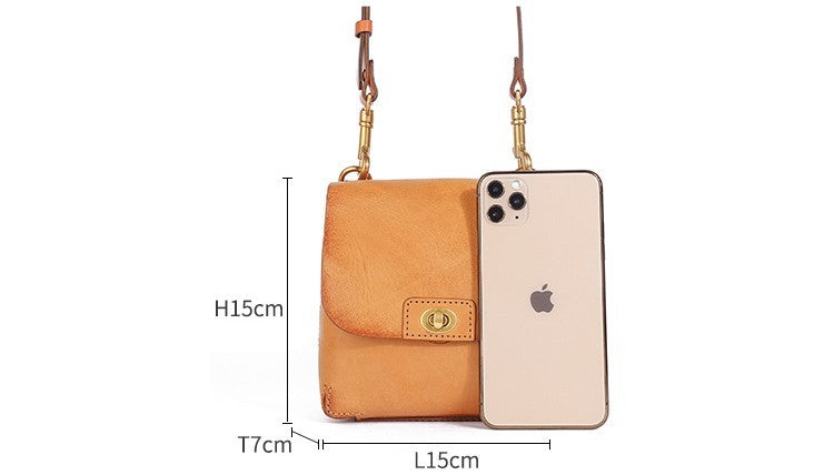 Brown phone case with measurements and an Apple phone for scale on a white background