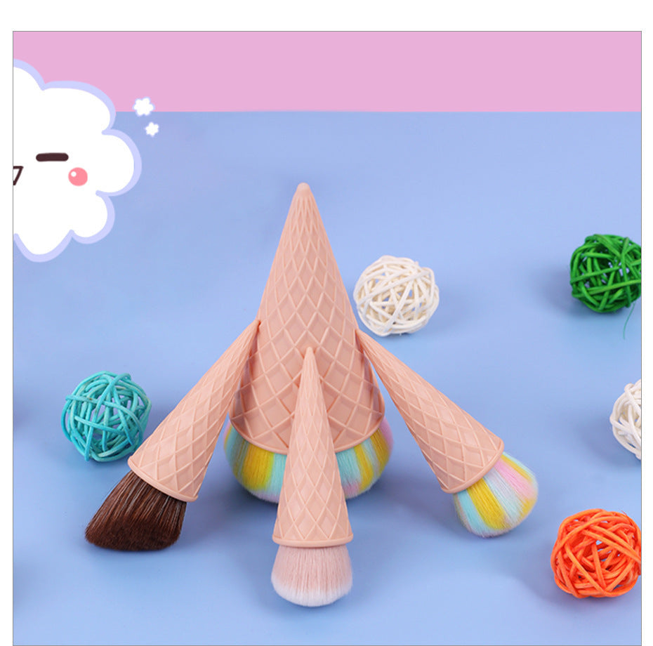 Ice cream cone-shaped makeup brushes on a blue background with decorative balls.