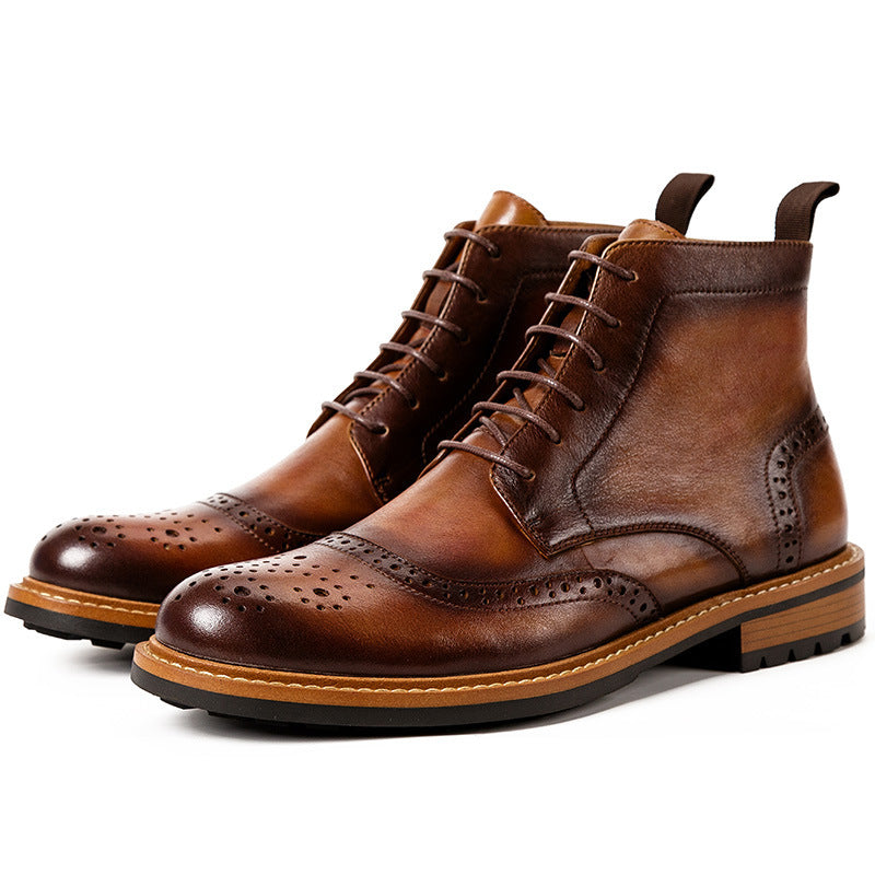 Pair of brown leather boots on a white background