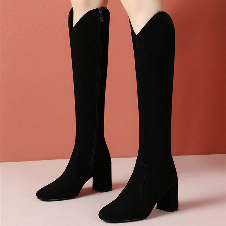 Black knee-high boots on a pink background