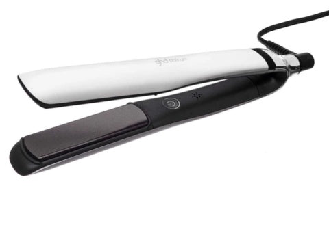 Black and white hair straightener on a white background