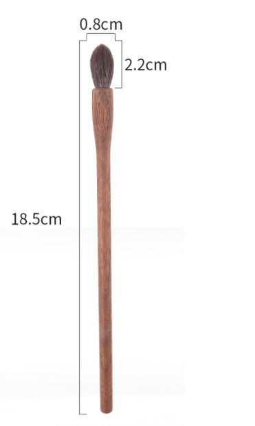 Wooden brush with measurements on a white background