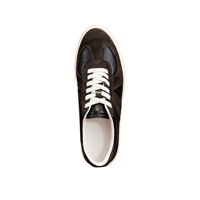 Brown sneaker with white laces on a white background