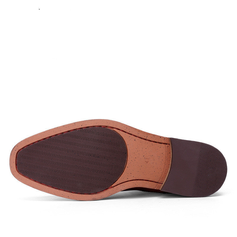 Close-up of a shoe sole with brown and tan colors on a white background