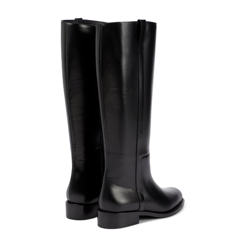 Pair of black knee-high boots on a white background