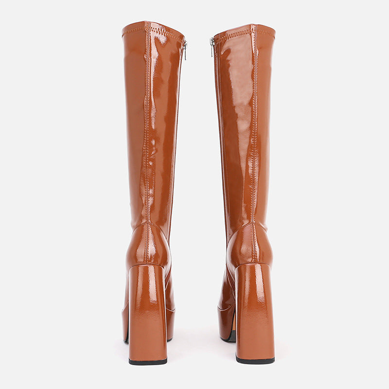 Pair of brown knee-high boots on a white background