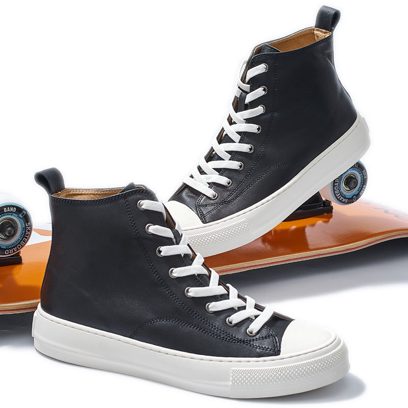 Black high-top sneakers with white laces on a white background