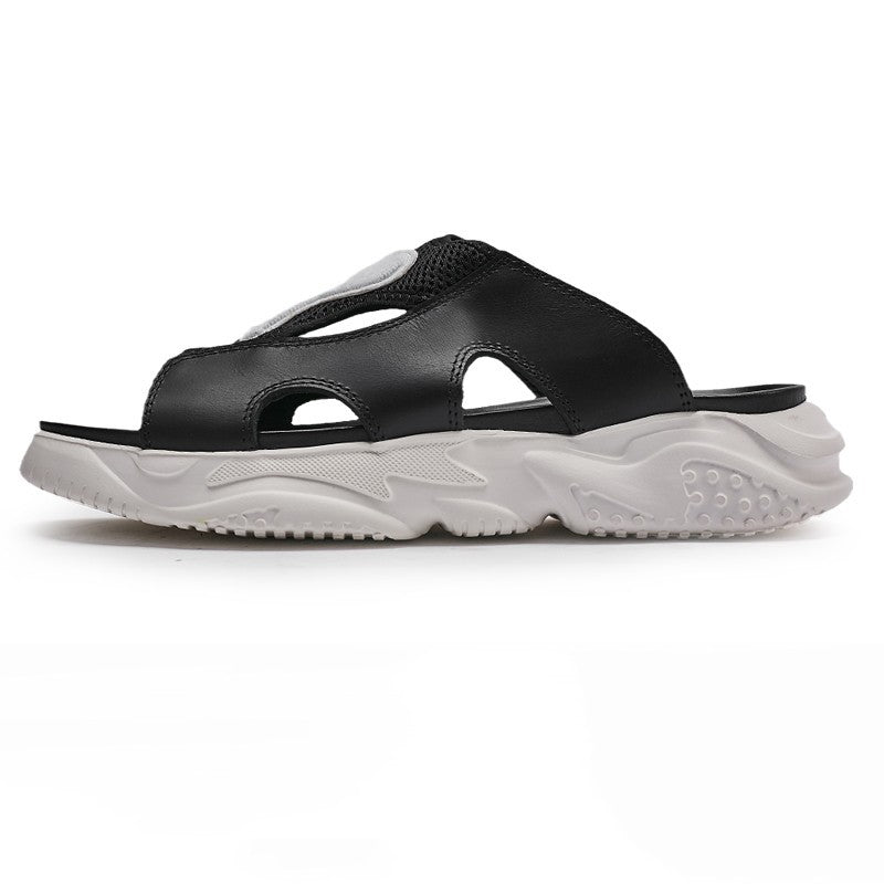 Black sandal with a white sole on a white background