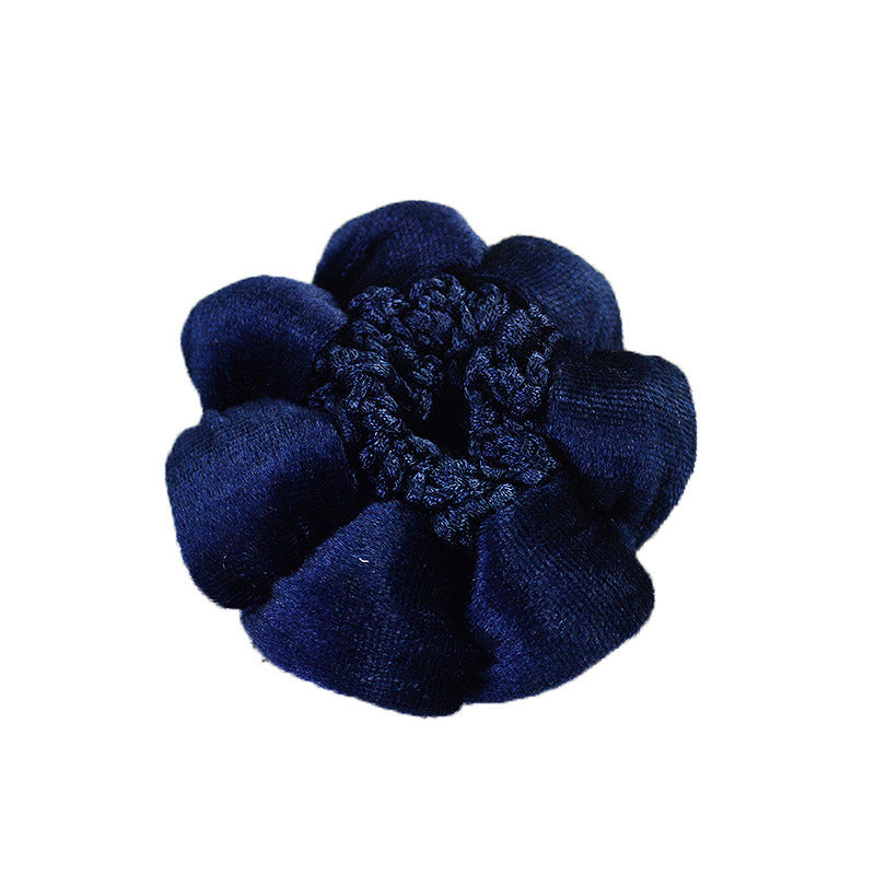 Navy blue scrunchie on a white background