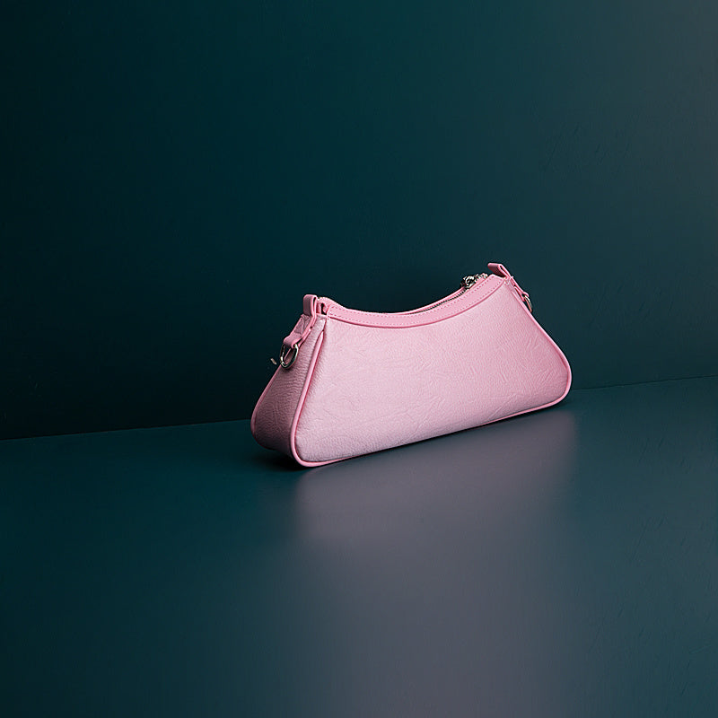 Pink handbag on a dark green background