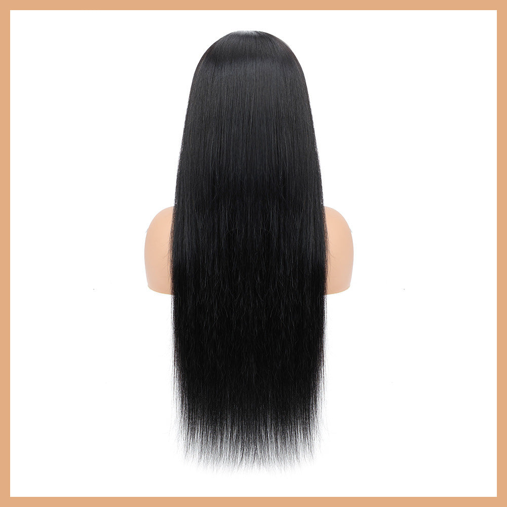 Black straight wig on a mannequin head against a white background