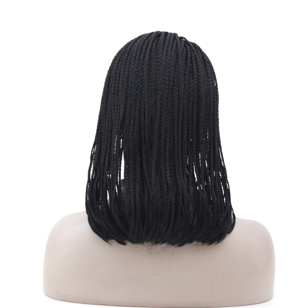 Black braided wig on a mannequin head against a white background