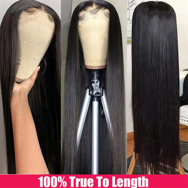 Black straight wig on a mannequin head with a hand holding it, displayed against a neutral background.