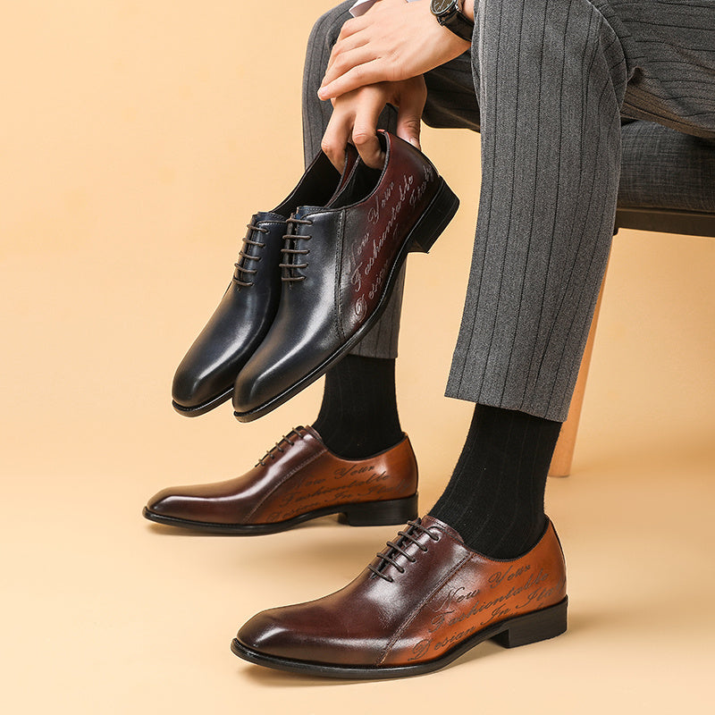 Person wearing brown and black dress shoes with gray pants on a beige background