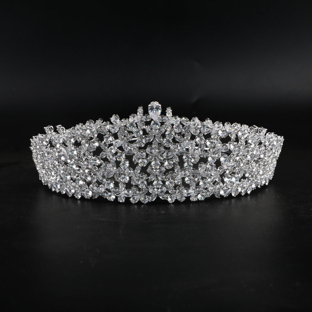 Silver tiara with clear stones on a black background