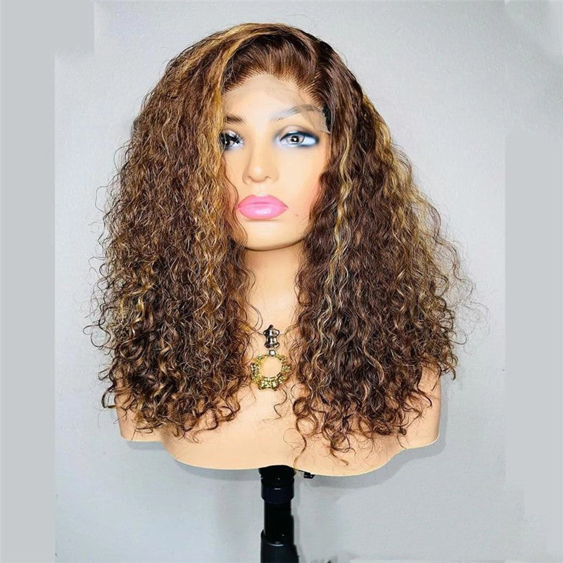 Mannequin head with a brown curly wig on a plain background