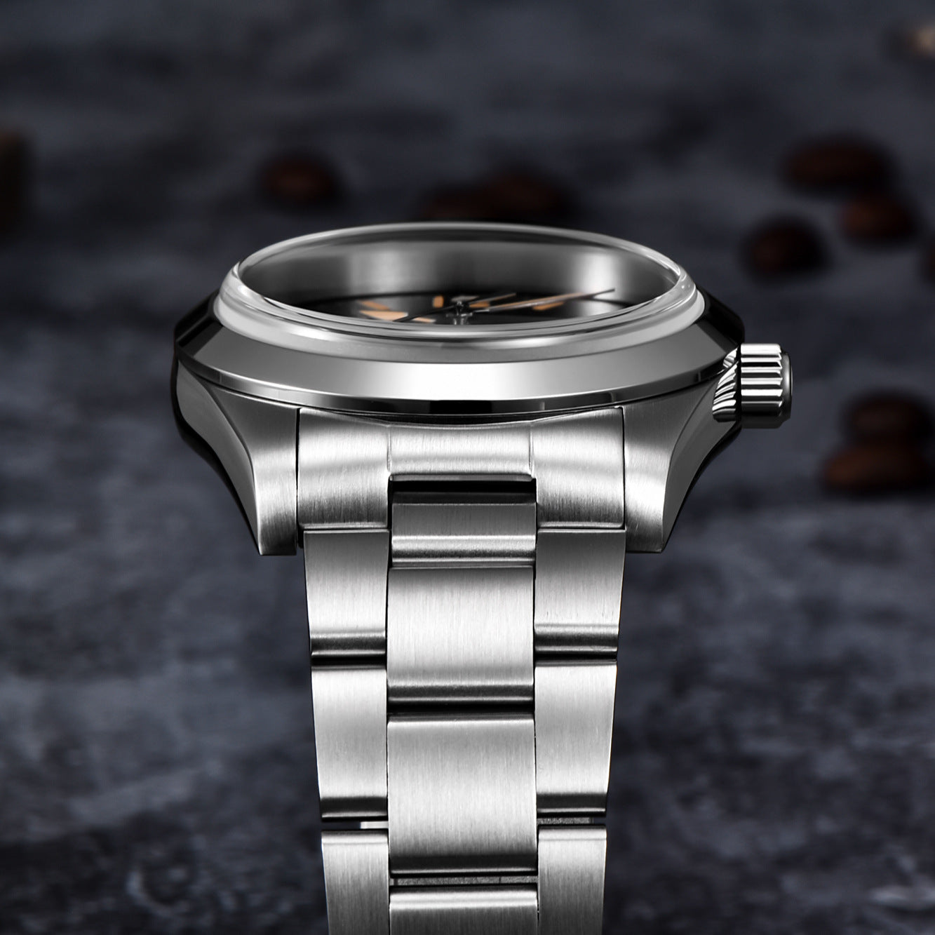 Silver watch with a dark textured background