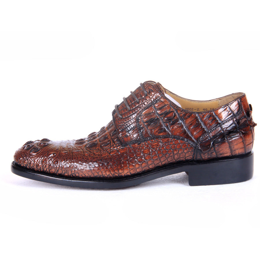 Brown crocodile-patterned shoe on a white background