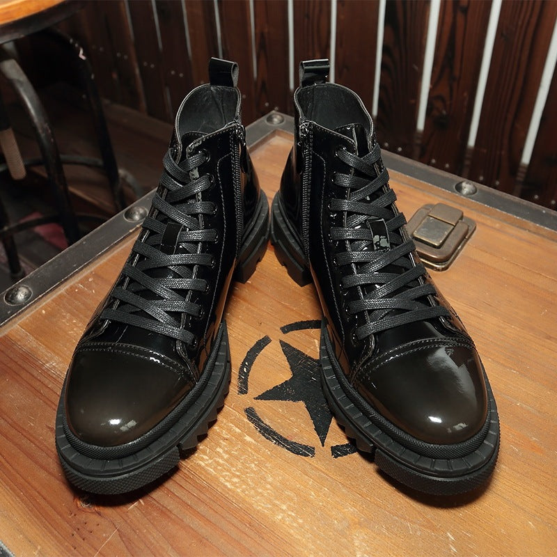 Pair of black high-top boots on a wooden surface with a star logo.
