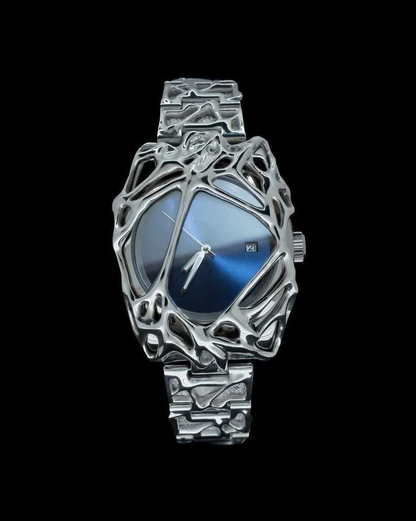 Silver watch with intricate design on a black background