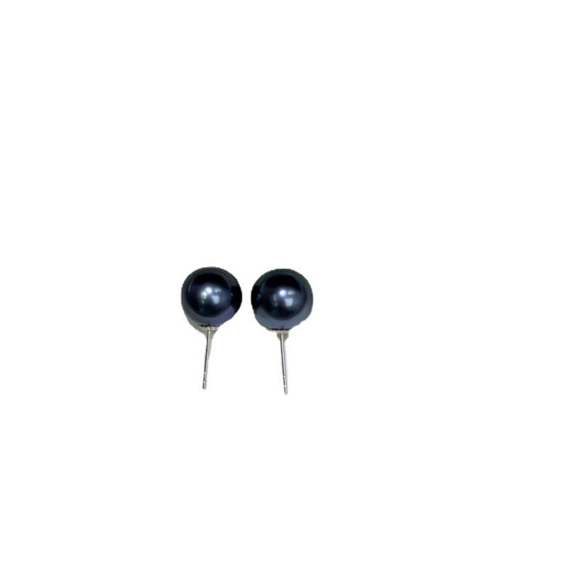Pair of black pearl earrings on a white background