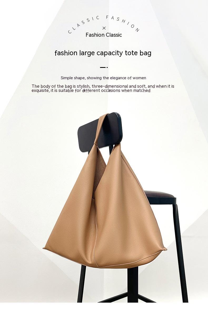 Beige tote bag on a black chair with text about fashion and capacity.