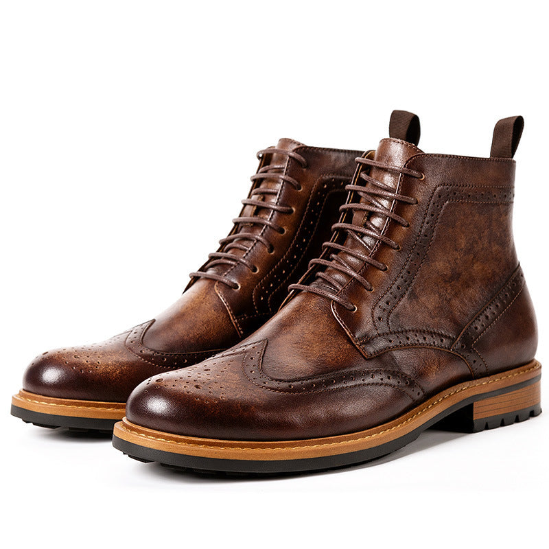 Pair of brown leather boots on a white background