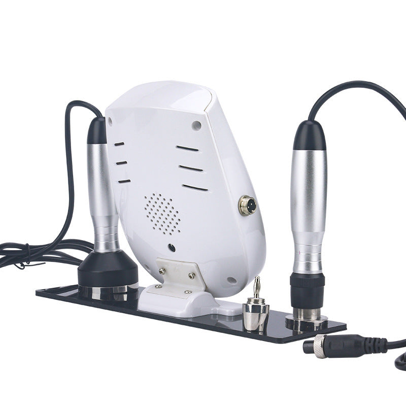 White dental milling machine with two attachments on a white background