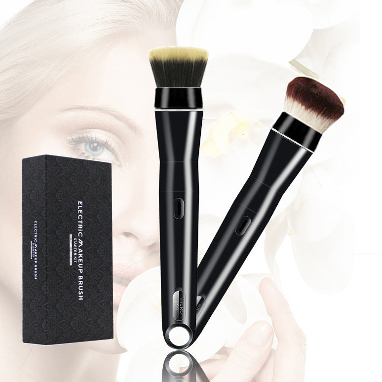 Two black electric makeup brushes with a packaging box on a blurred background