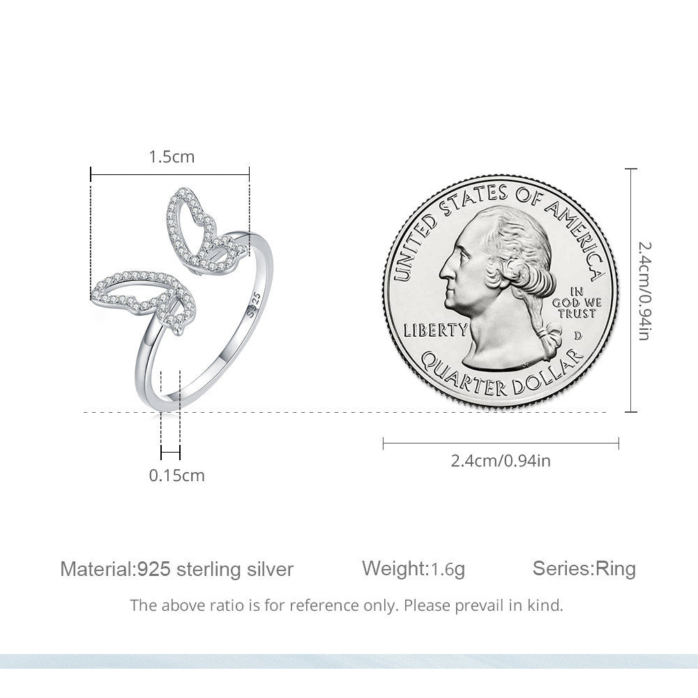 Silver ring with measurements relative to a quarter dollar coin on a white background