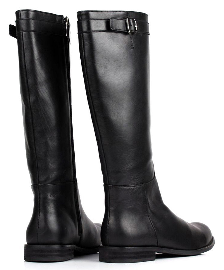 Pair of black knee-high boots on a white background