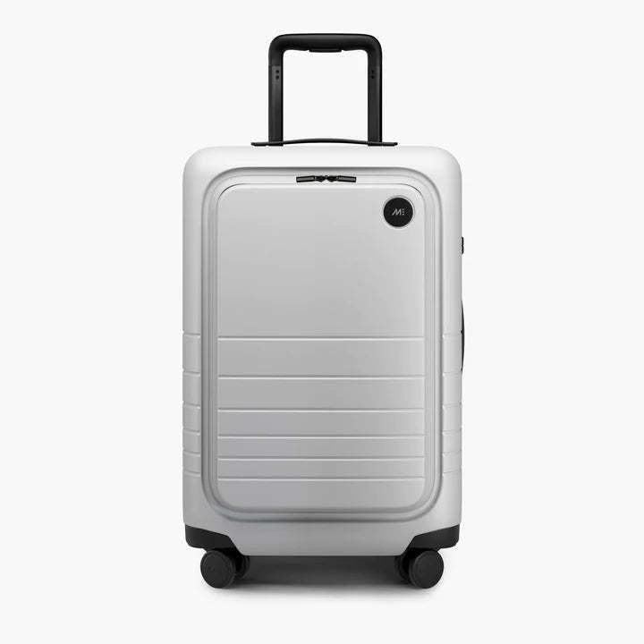 White suitcase with black handle and wheels on a white background