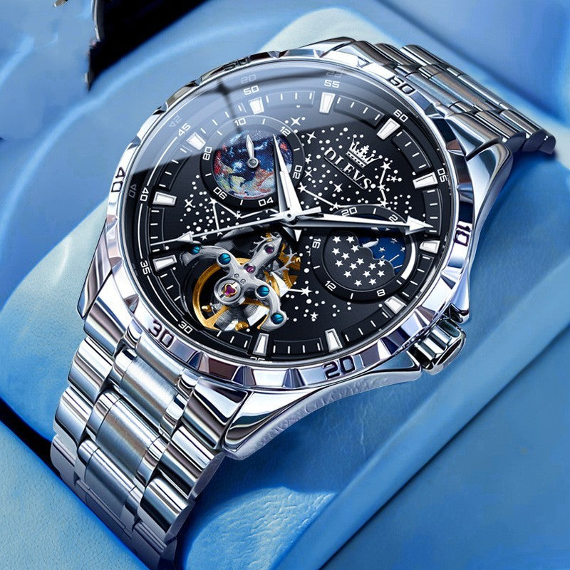 Luxury silver watch with a detailed face on a blue background