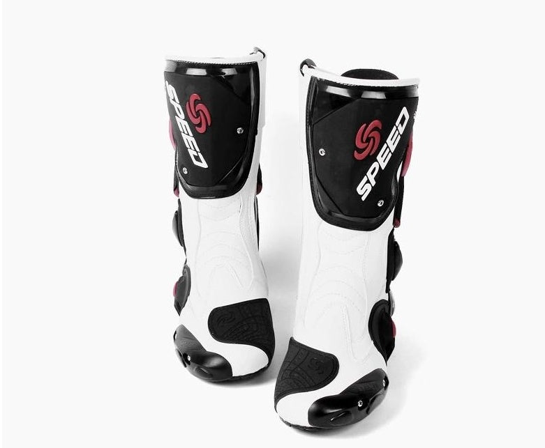Pair of white and black racing boots with 'Speed' branding on a white background