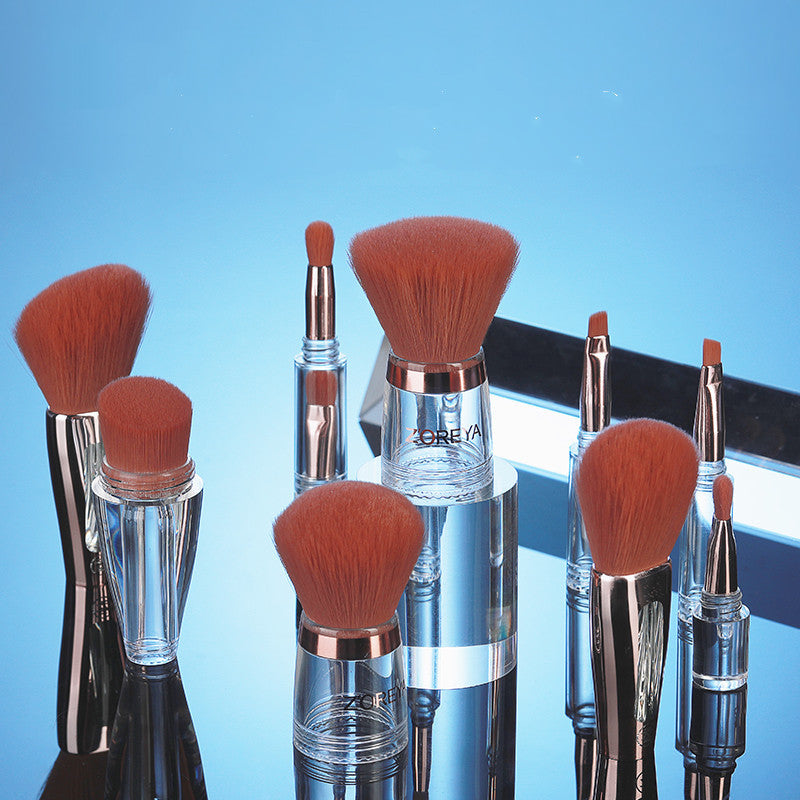 Set of makeup brushes with brown bristles on a blue background