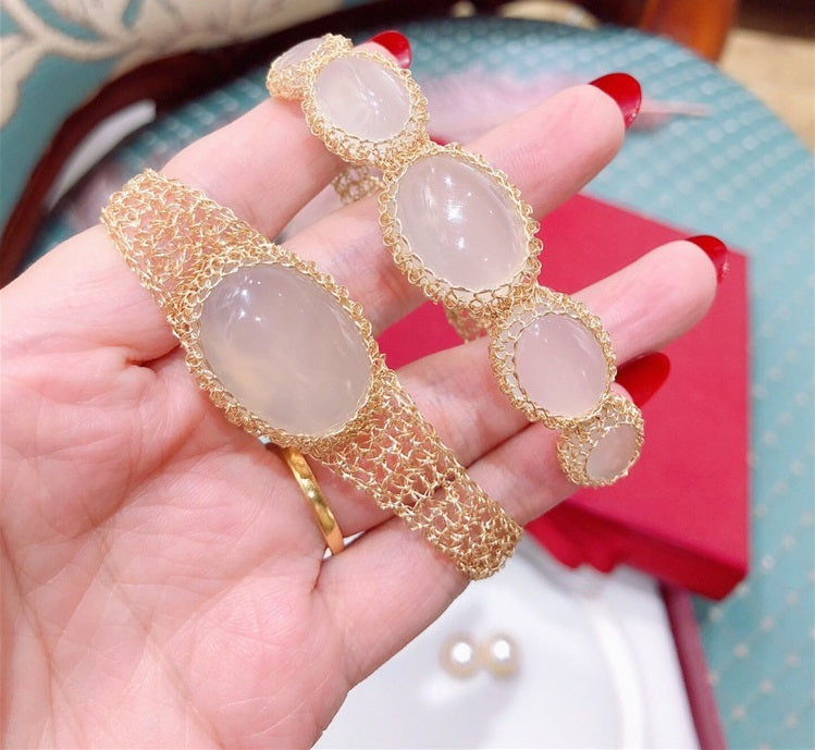 14k Gold Wire Natural White Chalcedony Bracelet with oval stones and intricate wire mesh design on hand