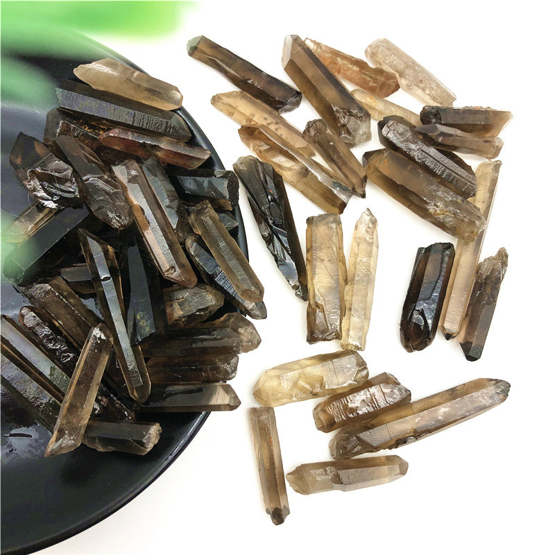 Collection of brown crystal pieces on a white background