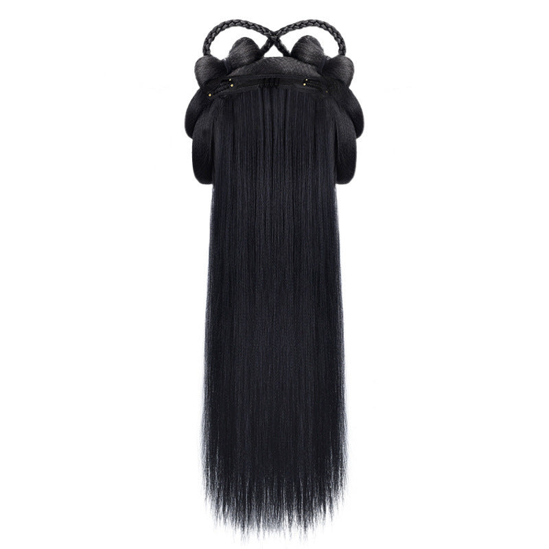 Black hair extension with a decorative clip on a white background